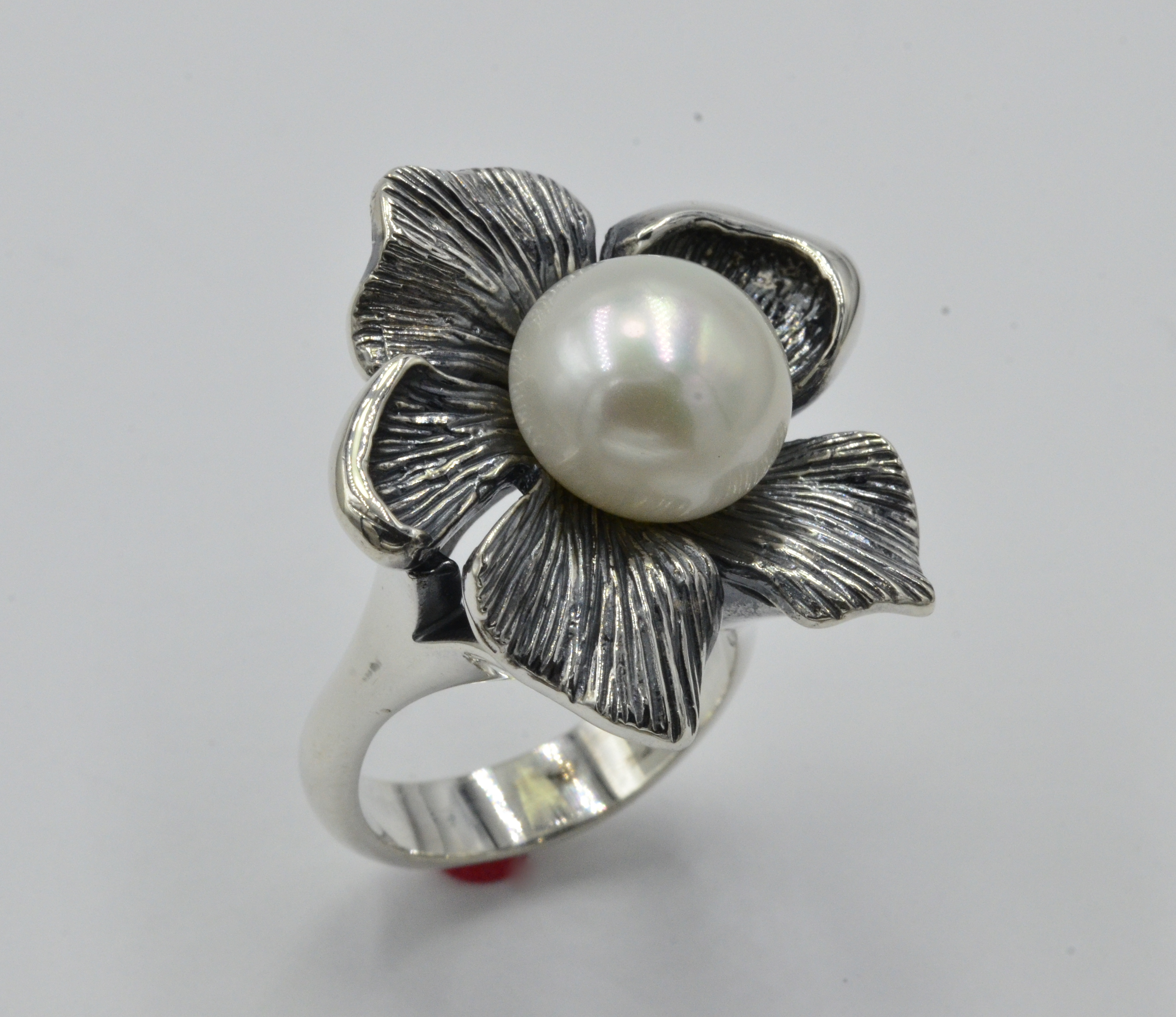 Hand crafted abstract Flower ring. Very popular gift that girlfriends chip in on when one of the girls has a special birthday.